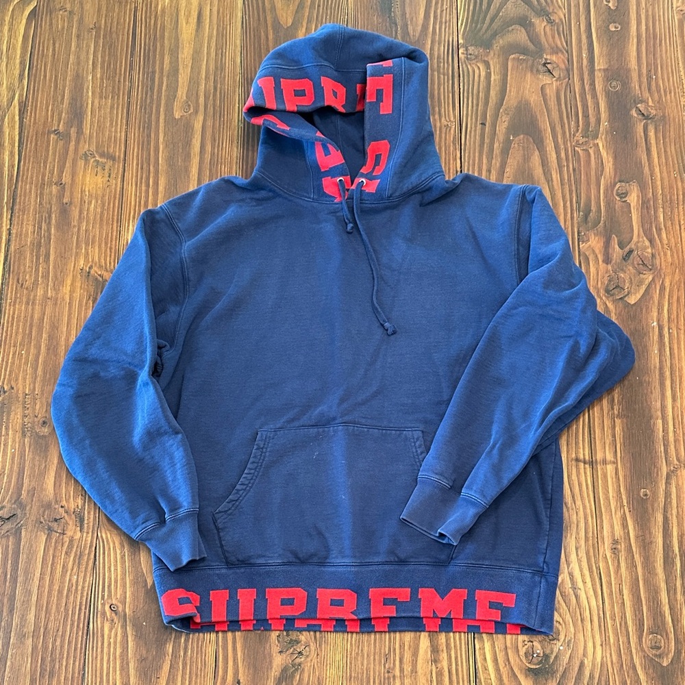 Supreme Dark Blue Hoodie with cropped logo Red Lettering.